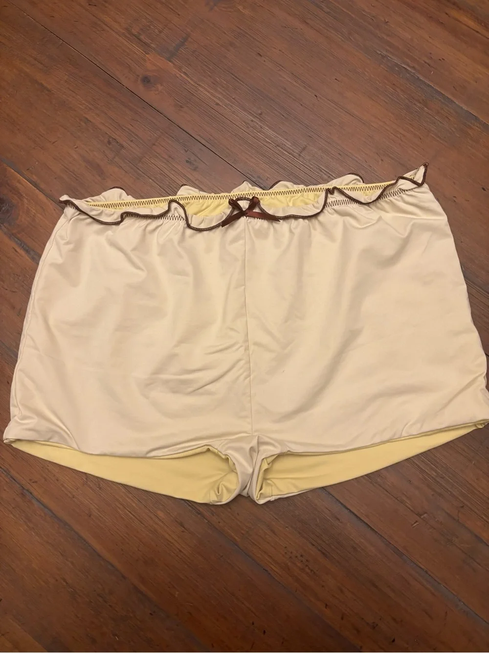 Frankie’s bikinis x Gigi HADID yellow swim shorts with brown trim